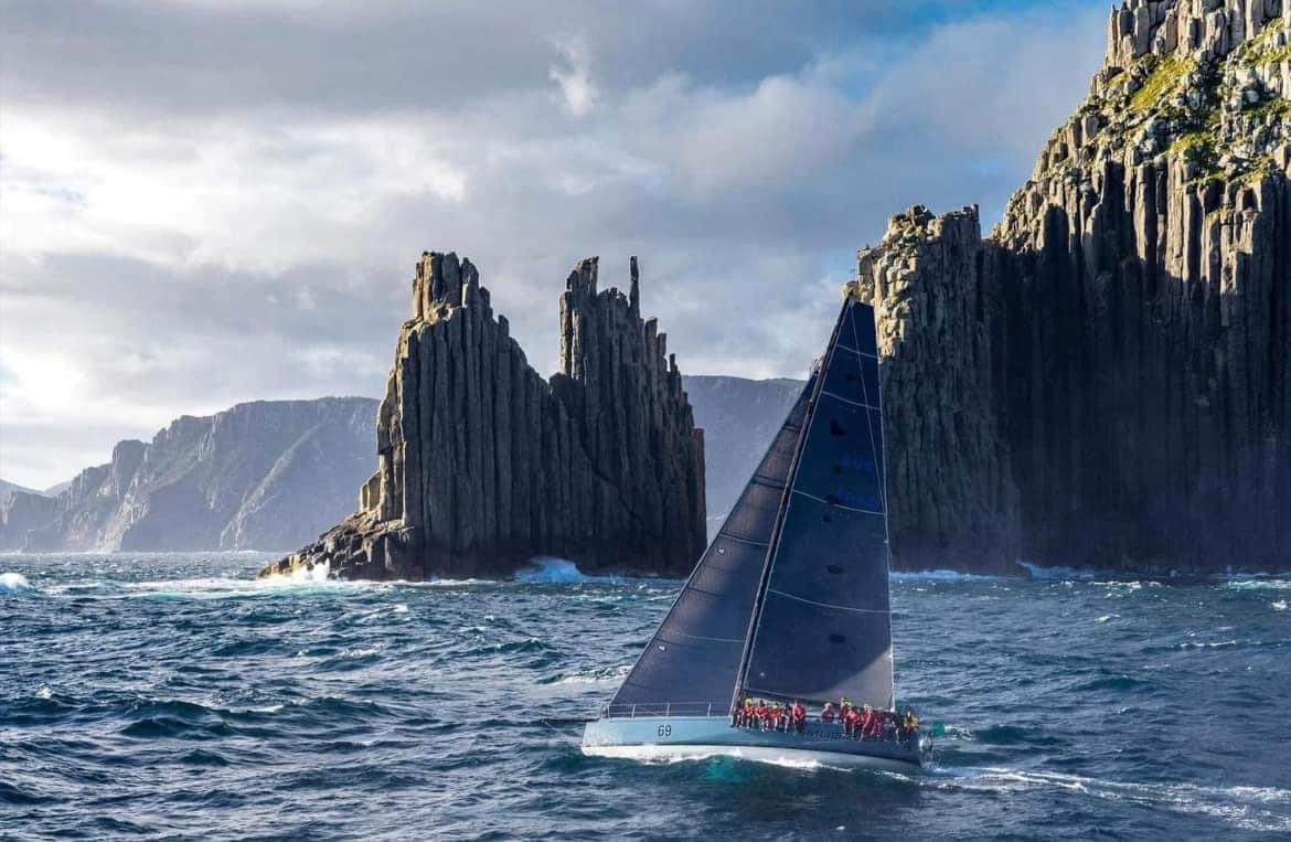 Offshore yacht sailing past the Tasmanian coast